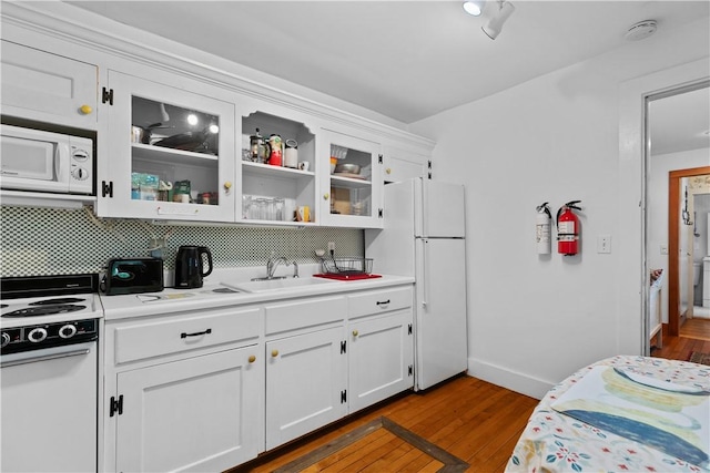 8001 Post Rd, North Kingstown, RI 02852 - kitchen with white appliances, light countertops, tasteful backsplash, and dark wood-style floors