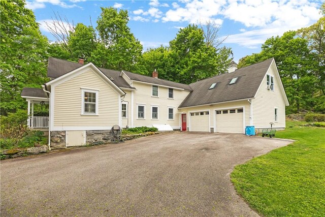 8001 Post Rd, North Kingstown, RI 02852 - view of front of property with driveway, a garage, a chimney, and a front yard