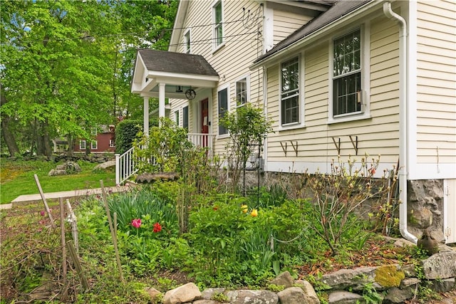 8001 Post Rd, North Kingstown, RI 02852 - view of side of property featuring covered porch
