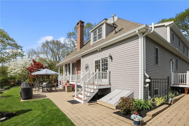 115 Read St, Attleboro, MA 02703 - rear view of house with a patio area, a chimney, a yard, and a shingled roof
