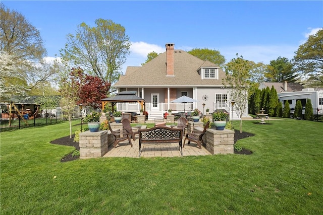 115 Read St, Attleboro, MA 02703 - back of property with a patio, a gazebo, outdoor lounge area, a chimney, and roof with shingles