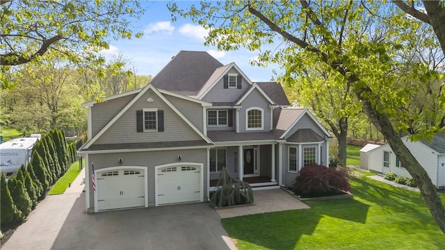 115 Read St, Attleboro, MA 02703 - view of front of house with an attached garage, a front yard, driveway, and a porch