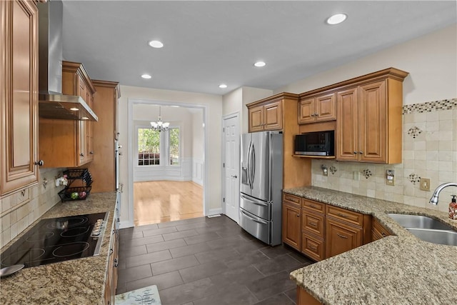 115 Read St, Attleboro, MA 02703 - kitchen with stainless steel refrigerator with ice dispenser, a sink, wall chimney exhaust hood, a chandelier, and black electric stovetop