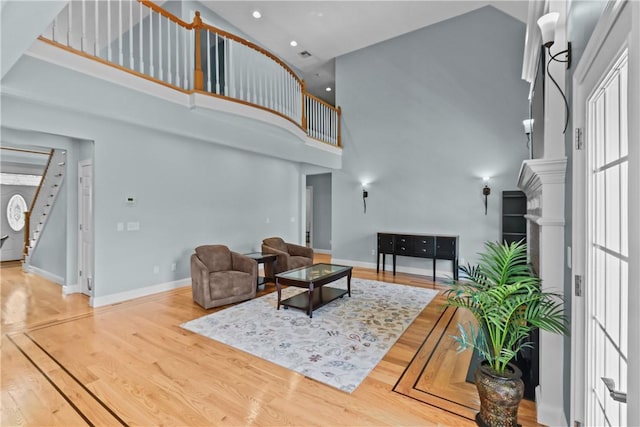 115 Read St, Attleboro, MA 02703 - living area with a high ceiling, wood finished floors, baseboards, stairway, and recessed lighting