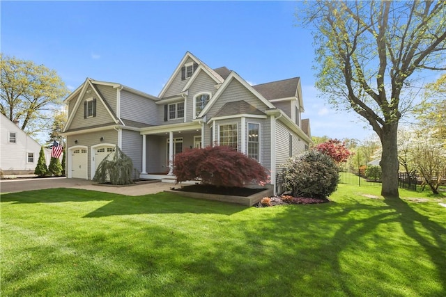 115 Read St, Attleboro, MA 02703 - view of front facade featuring an attached garage, asphalt driveway, and covered porch