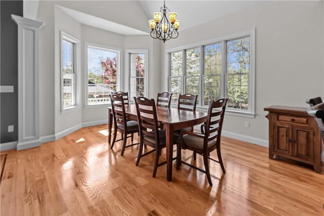 115 Read St, Attleboro, MA 02703 - dining space featuring lofted ceiling, a chandelier, healthy amount of natural light, baseboards, and light wood finished floors