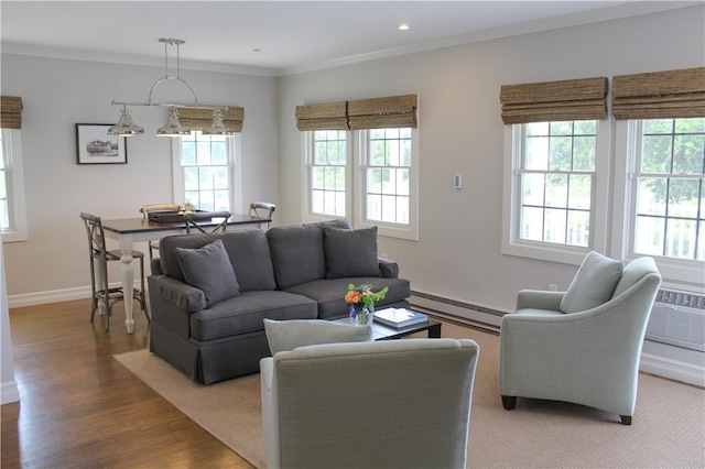 44 Bay St Unit B110, Westerly, RI 02891 - living area featuring a baseboard radiator, light wood finished floors, baseboards, ornamental molding, and recessed lighting