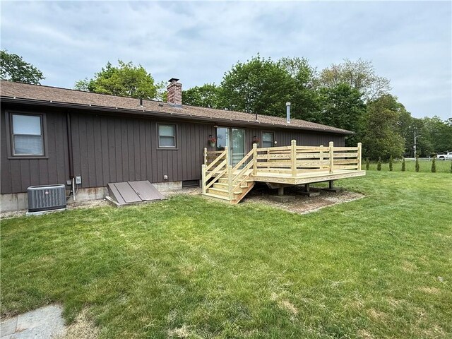 446 Angell Rd, North Providence, RI 02904 - rear view of house with a deck, a chimney, a yard, and central AC