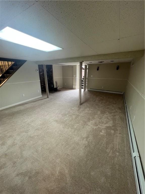446 Angell Rd, North Providence, RI 02904 - finished basement featuring carpet flooring, stairway, baseboard heating, a baseboard heating unit, and baseboards