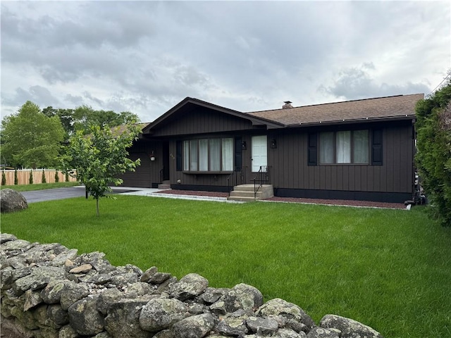 446 Angell Rd, North Providence, RI 02904 - single story home featuring a front lawn, an attached garage, driveway, a chimney, and roof with shingles