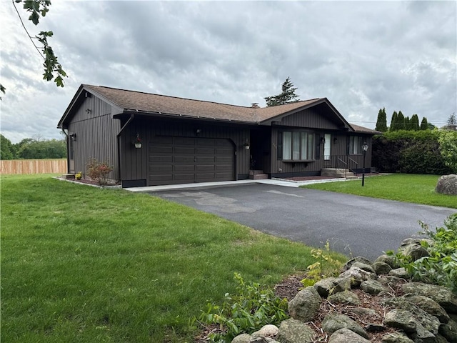 446 Angell Rd, North Providence, RI 02904 - ranch-style home with driveway, an attached garage, and board and batten siding