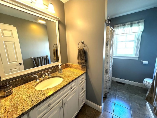 bathroom with baseboards, toilet, vanity, tile patterned floors, and a shower with curtain