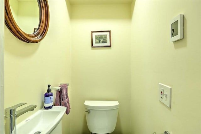 bathroom with a sink and toilet