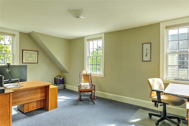 office space featuring carpet floors, baseboards, and plenty of natural light