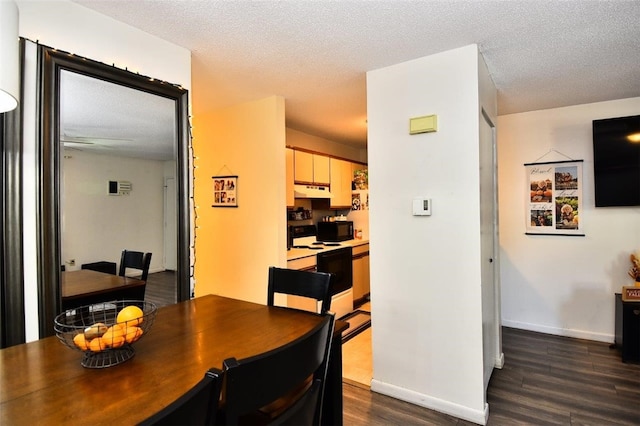 21 Apache Dr Unit D, Westerly, RI 02891 - dining space featuring dark wood-style flooring, baseboards, and a textured ceiling