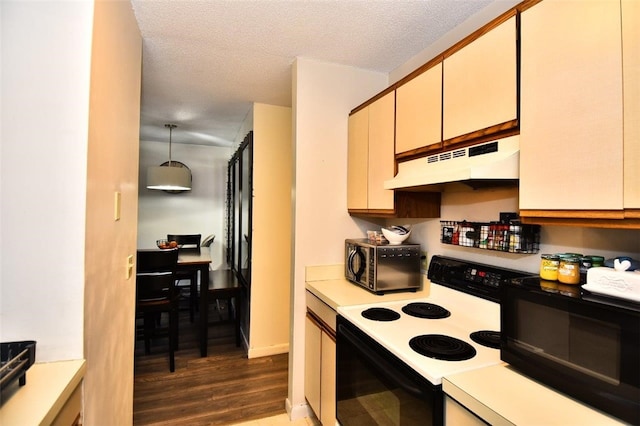 21 Apache Dr Unit D, Westerly, RI 02891 - kitchen featuring electric stove, under cabinet range hood, black microwave, light countertops, and a textured ceiling