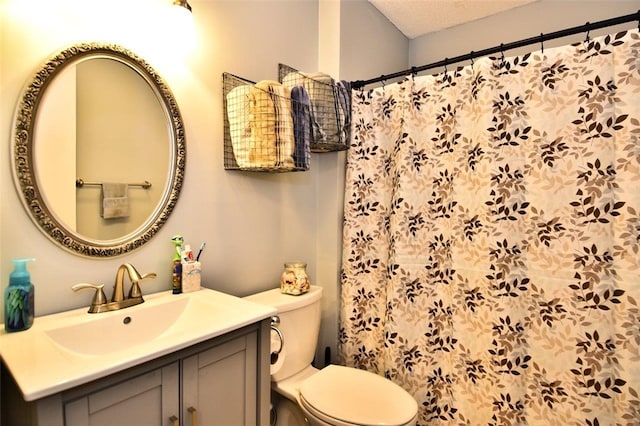 21 Apache Dr Unit D, Westerly, RI 02891 - bathroom featuring toilet, vanity, and curtained shower