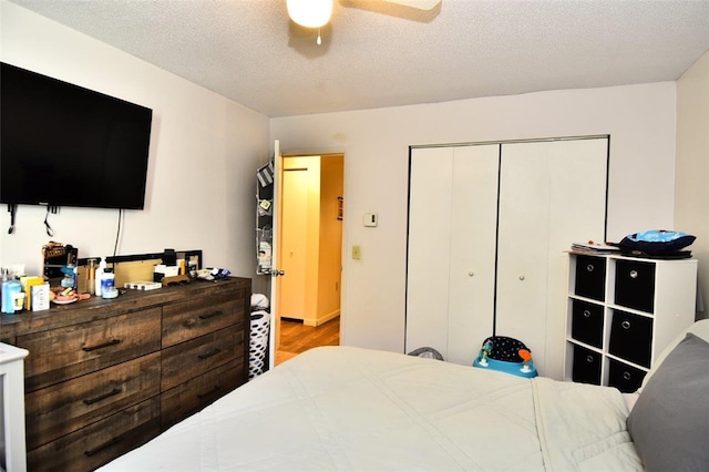21 Apache Dr Unit D, Westerly, RI 02891 - bedroom with a closet, wood finished floors, a ceiling fan, and a textured ceiling