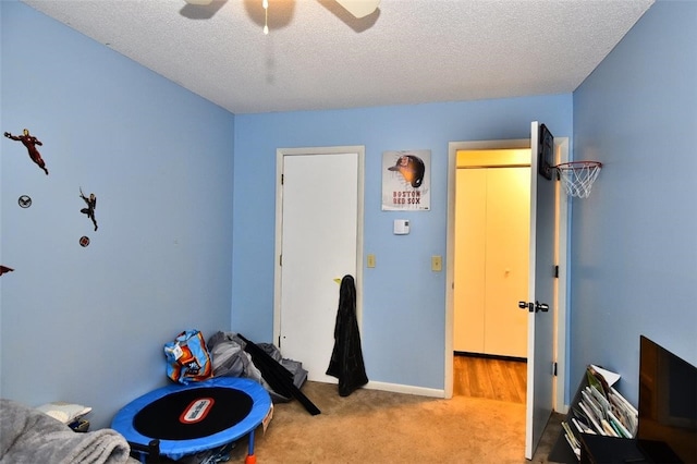 21 Apache Dr Unit D, Westerly, RI 02891 - carpeted bedroom featuring a textured ceiling and a ceiling fan