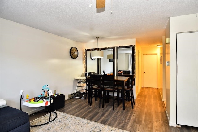 21 Apache Dr Unit D, Westerly, RI 02891 - dining space with dark wood-style flooring, ceiling fan, a textured ceiling, and baseboards