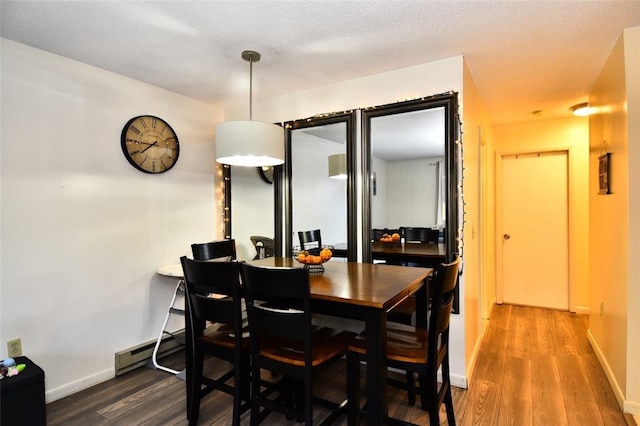 21 Apache Dr Unit D, Westerly, RI 02891 - dining area with wood finished floors, baseboards, and baseboard heating