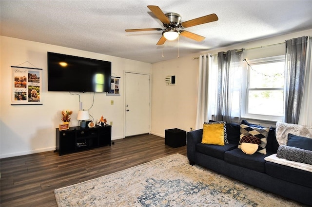 21 Apache Dr Unit D, Westerly, RI 02891 - living area featuring dark wood-style floors, ceiling fan, baseboards, and a textured ceiling