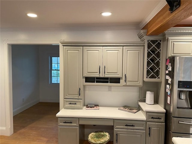 387 Camp Westwood Rd, Coventry, RI 02827 - kitchen with stainless steel fridge, ornamental molding, light countertops, wood finished floors, and baseboards