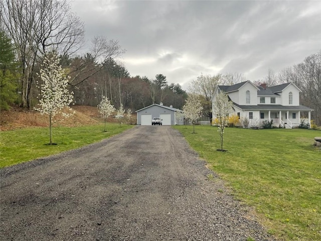 387 Camp Westwood Rd, Coventry, RI 02827 - view of front of house with an outbuilding, a garage, covered porch, a front yard, and a chimney