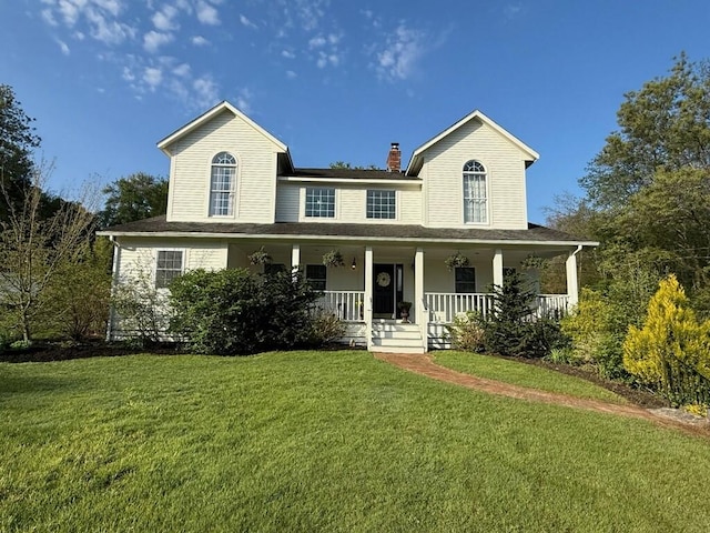 387 Camp Westwood Rd, Coventry, RI 02827 - view of front of property with a front yard, a chimney, and a porch