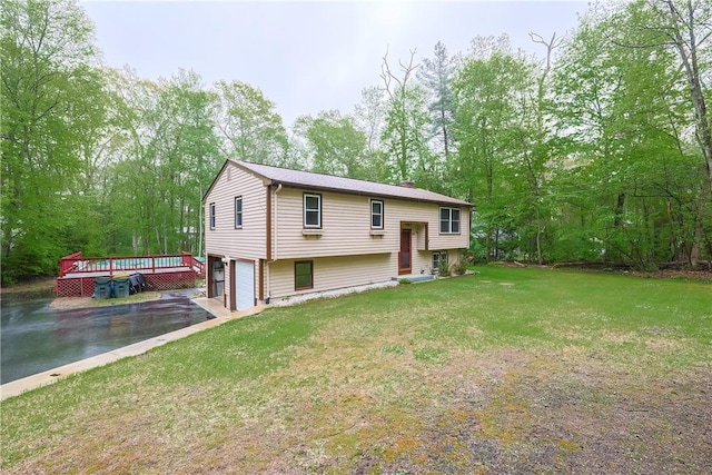 274 Courthouse Ln, Burrillville, RI 02859 - bi-level home featuring asphalt driveway, a front yard, and an attached garage