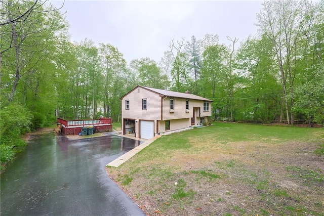 274 Courthouse Ln, Burrillville, RI 02859 - view of side of home featuring driveway, an attached garage, a deck, and a lawn
