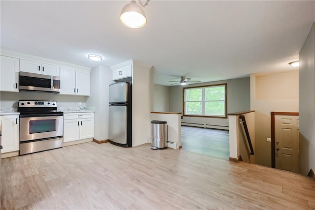 274 Courthouse Ln, Burrillville, RI 02859 - kitchen featuring stainless steel appliances, a baseboard heating unit, white cabinetry, ceiling fan, and light countertops