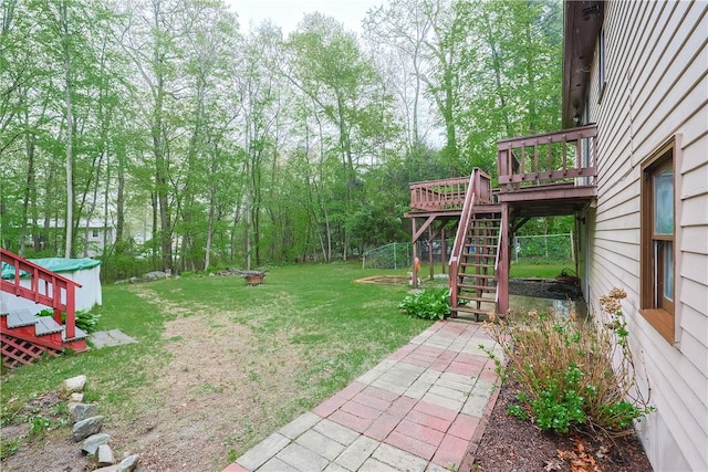 274 Courthouse Ln, Burrillville, RI 02859 - view of grassy yard with stairway, a wooden deck, and an outbuilding