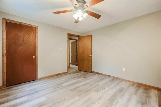 274 Courthouse Ln, Burrillville, RI 02859 - unfurnished bedroom with light wood-style flooring, baseboards, and ceiling fan