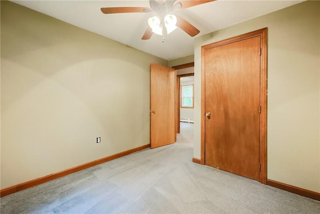 274 Courthouse Ln, Burrillville, RI 02859 - unfurnished bedroom featuring a baseboard heating unit, baseboards, light carpet, and a closet