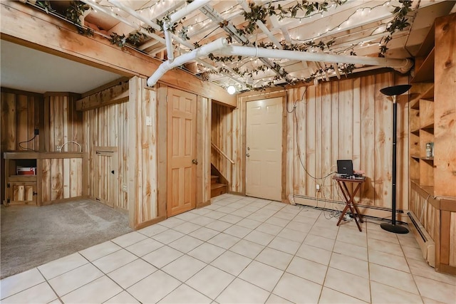 274 Courthouse Ln, Burrillville, RI 02859 - unfinished below grade area with stairway, a baseboard heating unit, and a desk