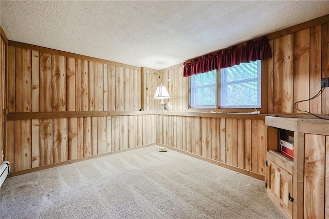 274 Courthouse Ln, Burrillville, RI 02859 - carpeted spare room featuring a textured ceiling and wood walls