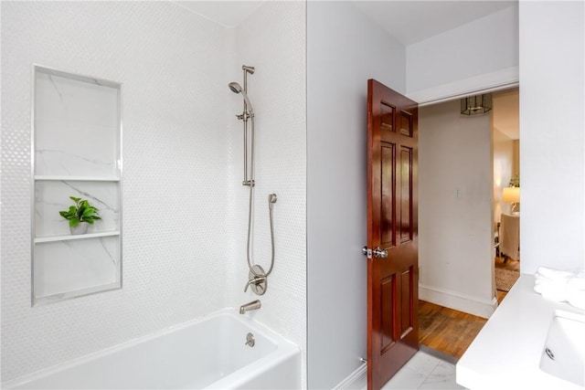 full bathroom with shower / washtub combination and baseboards