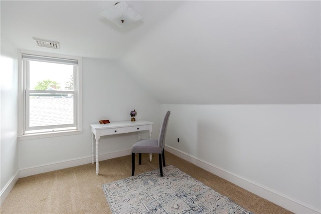 office space featuring carpet flooring, vaulted ceiling, and baseboards