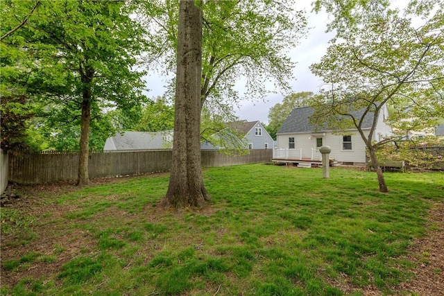 view of yard featuring a wooden deck