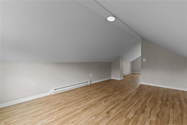 9 Lookout Ave, North Providence, RI 02911 - bonus room featuring baseboard heating, vaulted ceiling, light wood finished floors, and baseboards