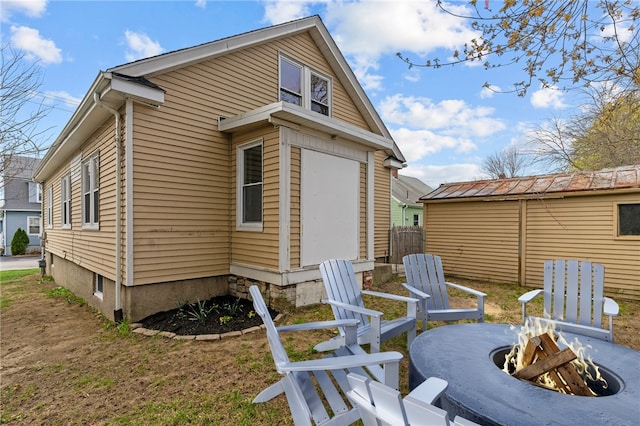 9 Lookout Ave, North Providence, RI 02911 - view of home's exterior featuring an outdoor fire pit