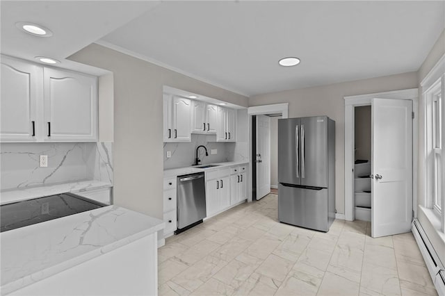 9 Lookout Ave, North Providence, RI 02911 - kitchen featuring appliances with stainless steel finishes, a baseboard radiator, a sink, white cabinetry, and light marble finish flooring