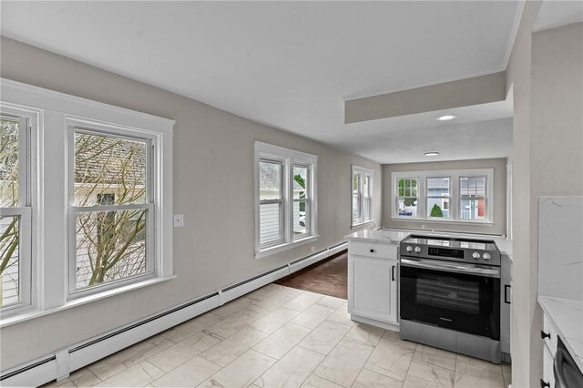 9 Lookout Ave, North Providence, RI 02911 - kitchen with stainless steel electric range oven, a baseboard heating unit, light marble finish floors, white cabinetry, and recessed lighting