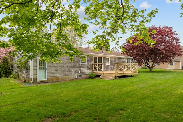 11 Cedar Ave, Middletown, RI 02842 - back of property with a chimney, a deck, and a yard