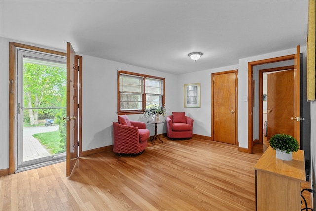 11 Cedar Ave, Middletown, RI 02842 - living area featuring baseboards and light wood-style flooring