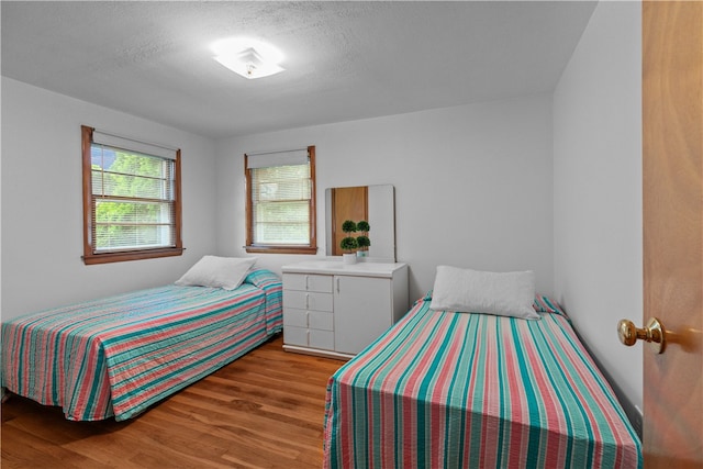 11 Cedar Ave, Middletown, RI 02842 - bedroom featuring wood finished floors and a textured ceiling