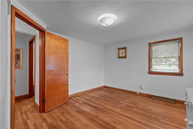 11 Cedar Ave, Middletown, RI 02842 - empty room with light wood-style flooring and baseboards