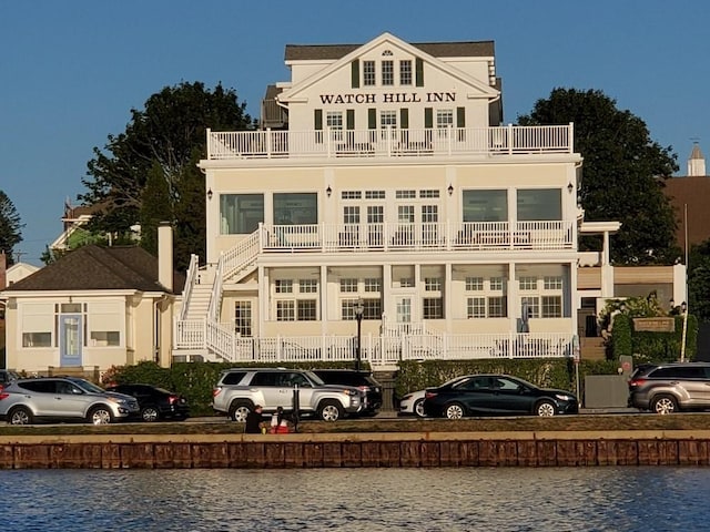 38 Bay St Unit W201/202, Westerly, RI 02891 - view of building exterior with stairs and a water view