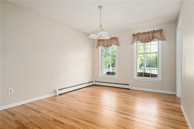 22 Linda Ln, South Windsor, CT 06074 - empty room with light wood-style flooring, baseboards, and a chandelier